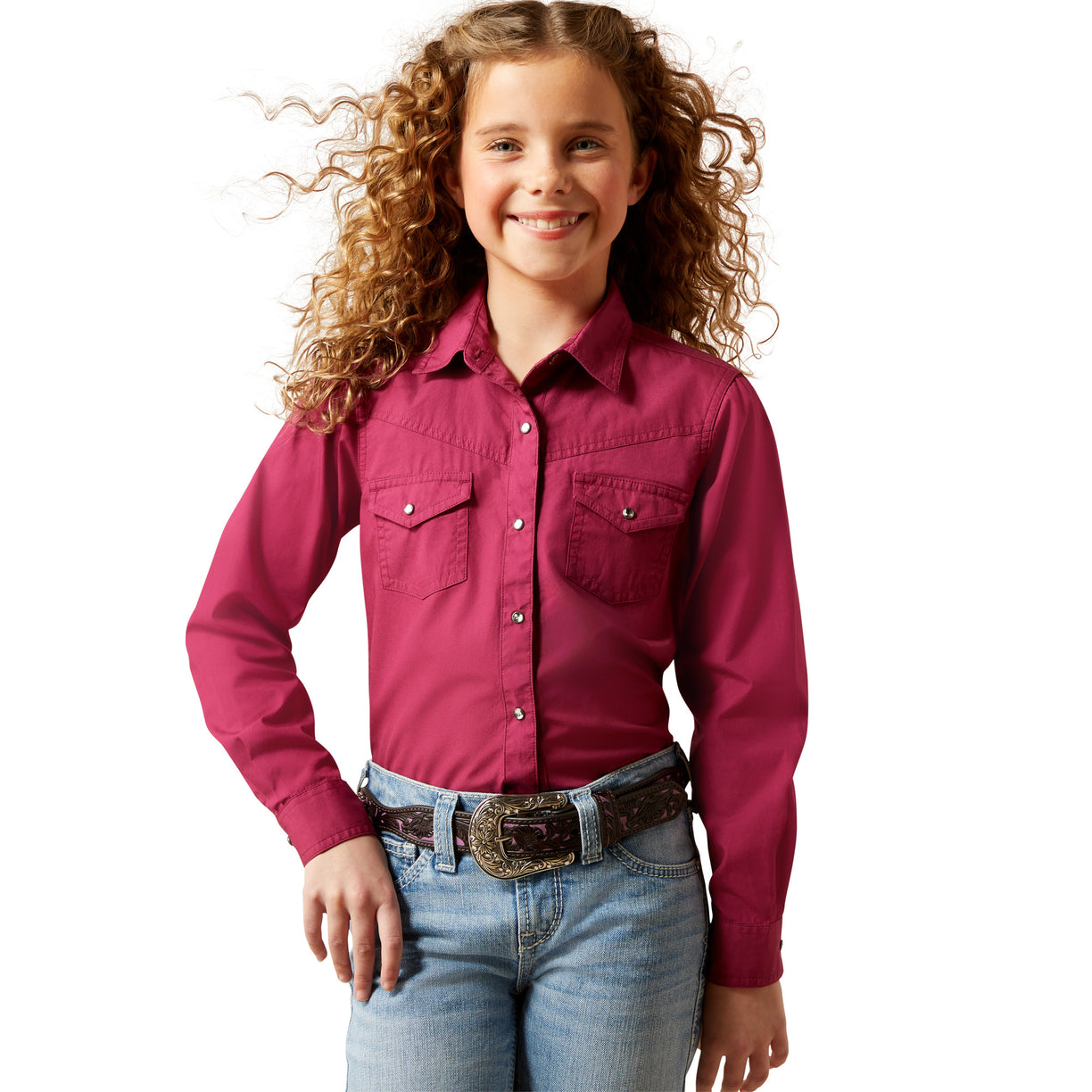 Young girl wearing a pink shirt and blue jeans on a white background