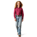 Child wearing a red shirt and blue jeans on a white background