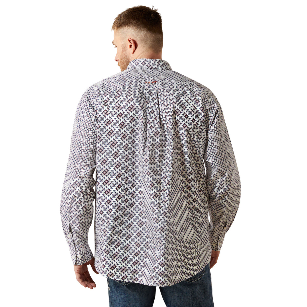 Man wearing a patterned shirt on a white background