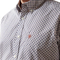 Close-up of a patterned shirt with a collar and buttons.