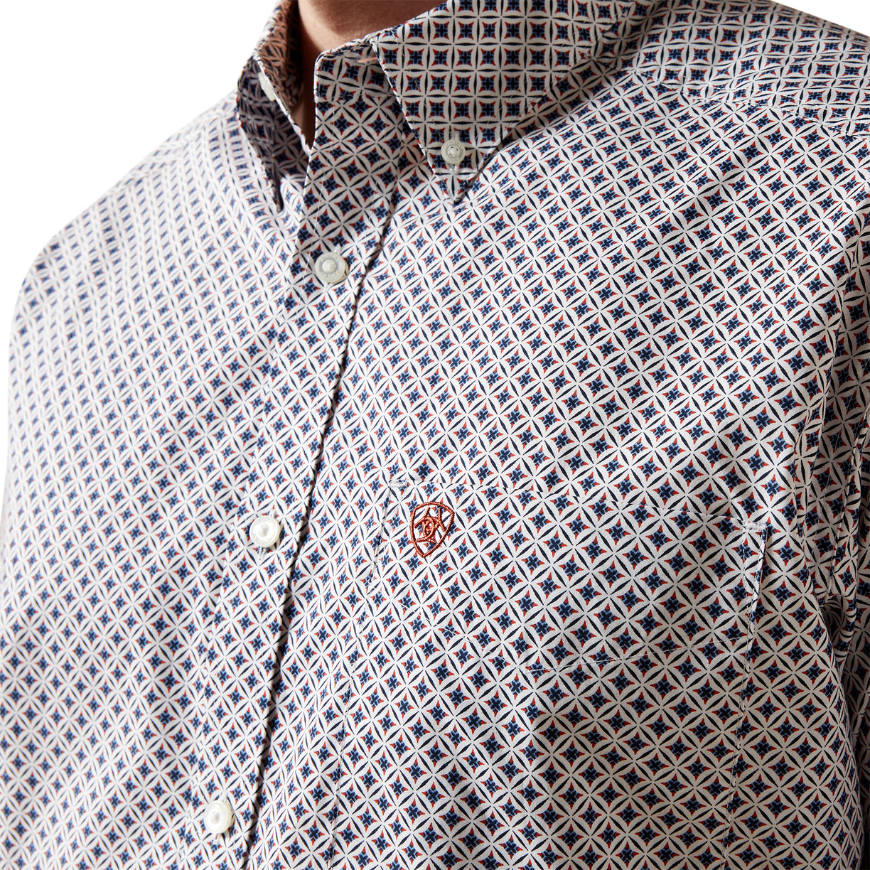 Close-up of a patterned shirt with a collar and buttons.