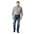 Man wearing a patterned shirt, jeans, and shoes on a white background