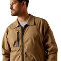 Man wearing a brown jacket on a white background