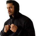 Man wearing a black hoodie against a white background