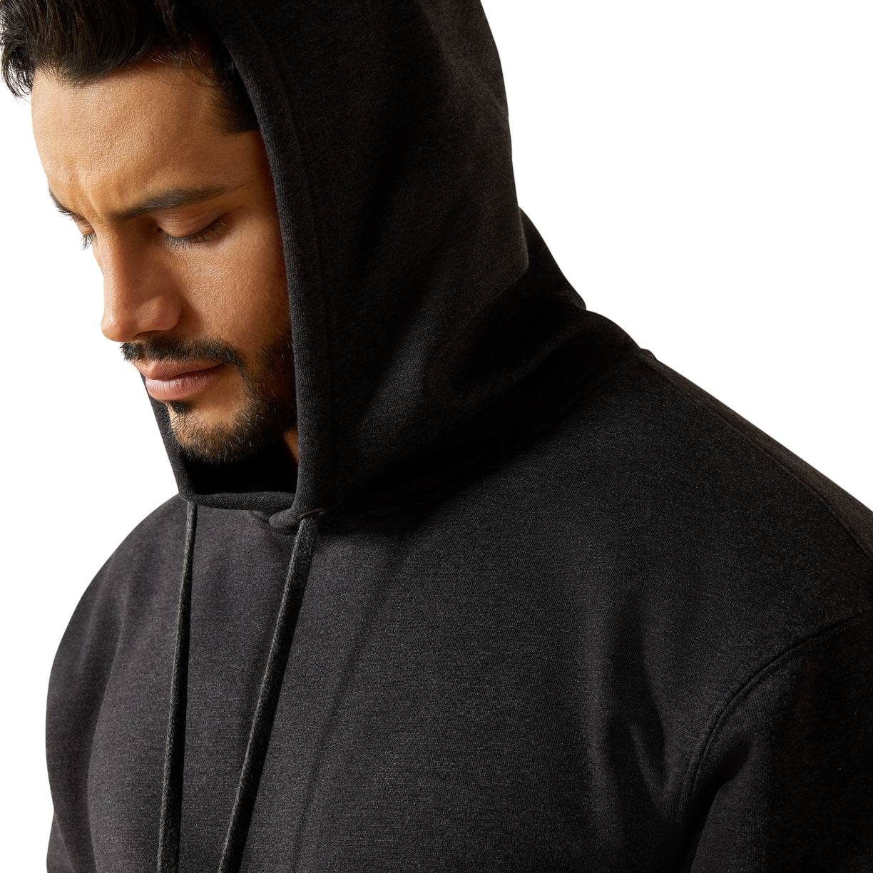 Man wearing a black hoodie against a white background