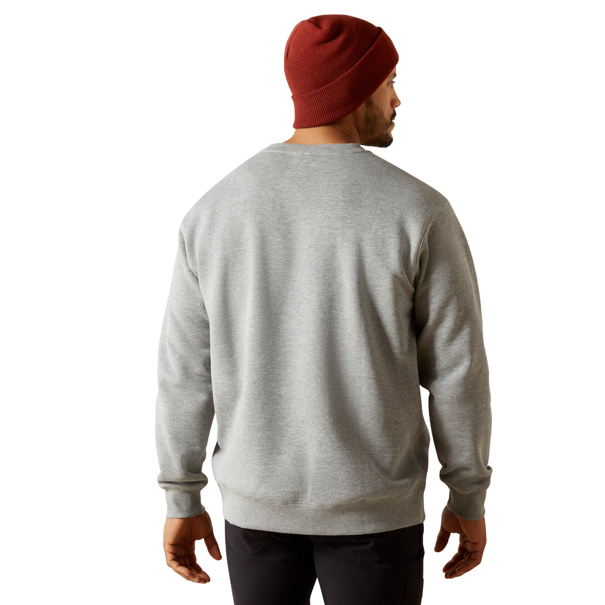 Person wearing a gray sweatshirt and red beanie on a white background