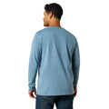 Man wearing a blue long-sleeve shirt on a white background