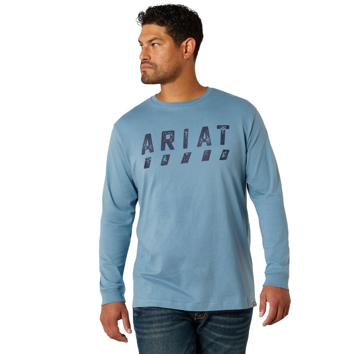 Man wearing a blue Ariat long-sleeve shirt on a white background