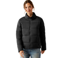 Woman wearing a black puffer jacket on a white background