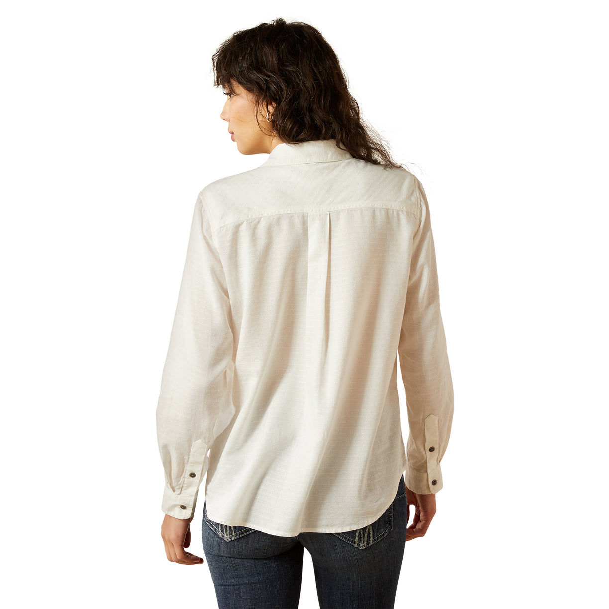 Woman wearing a beige button-up shirt on a white background