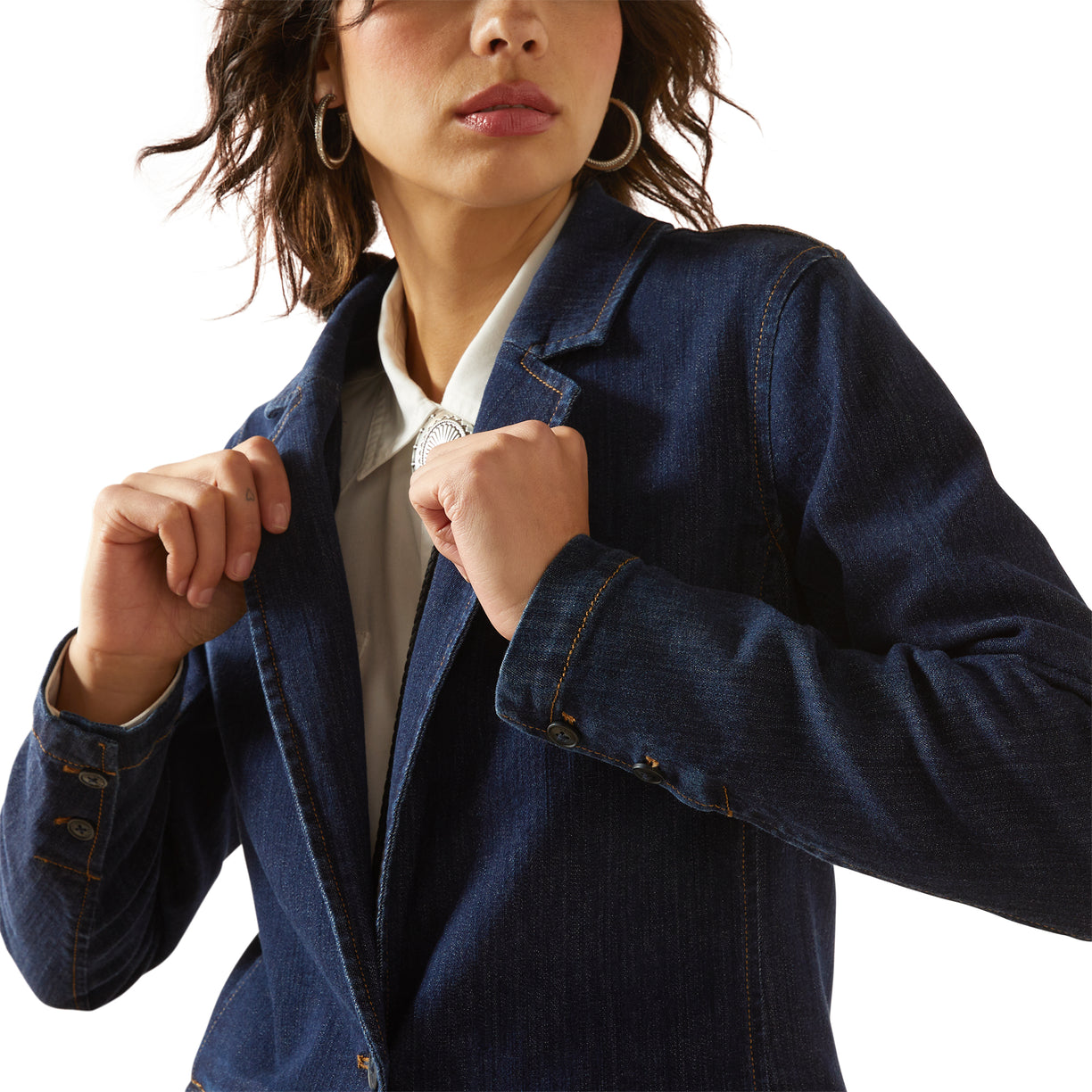 Woman wearing a blue denim jacket on a white background