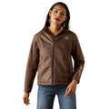 Woman wearing a brown Ariat jacket on a white background