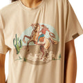 Beige t-shirt with a graphic of a cowboy on a horse and cactus