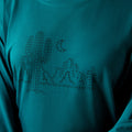 Teal long-sleeve shirt with a black cactus design on a matching teal background