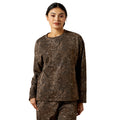 Woman wearing a camouflage outfit on a white background