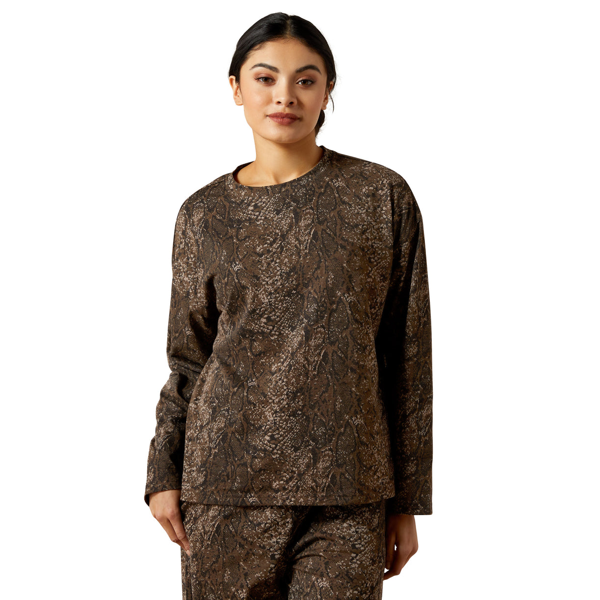 Woman wearing a camouflage outfit on a white background