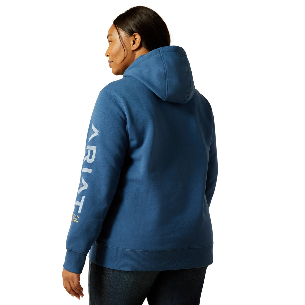 Person wearing a blue hoodie with 'Ariat' branding on the back, on a white background
