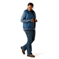 Woman wearing a blue jacket and jeans on a white background
