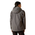 Person wearing a gray raincoat on a white background