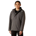 Person wearing a gray jacket on a white background
