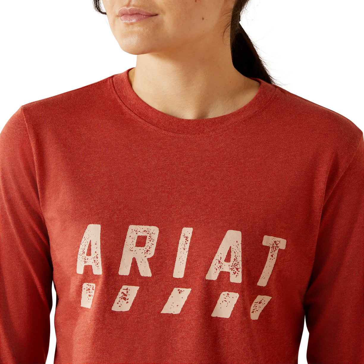Red sweatshirt with 'Ariat' logo worn by a person