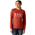 Person wearing a red long-sleeve shirt with 'Ariat' logo on a white background