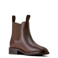 Brown leather Chelsea boot on a white background