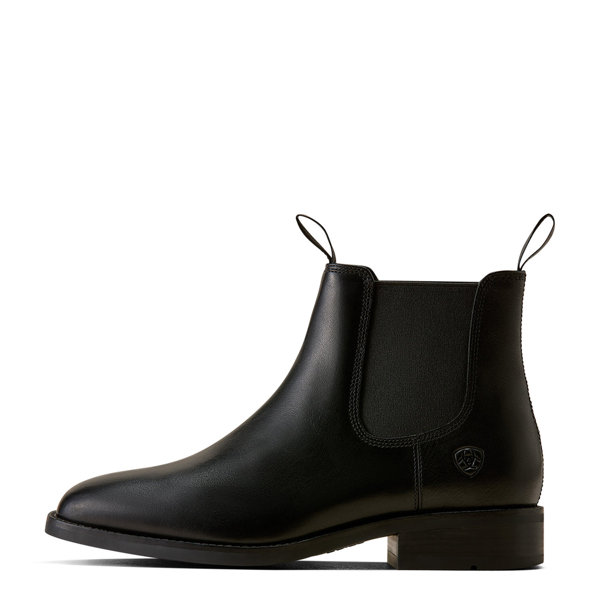 A black leather Chelsea boot with elastic side gore, pull tabs, and a low block heel, shown in profile against a plain white background.