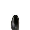 Close-up of the pointed toe of a black leather boot on a solid white background.