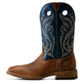 Brown cowboy boot with blue uppers and intricate stitching on a white background