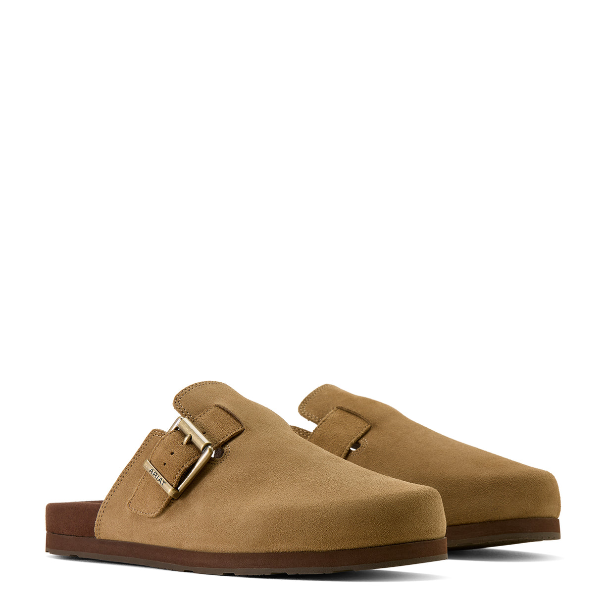 Pair of tan suede clogs with a gold buckle on a white background