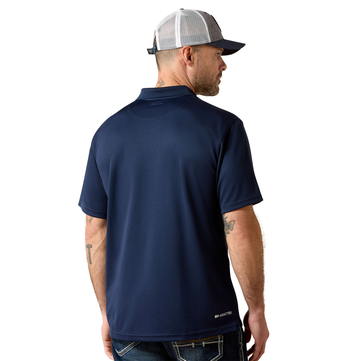 Man wearing a navy blue polo shirt and a cap on a white background