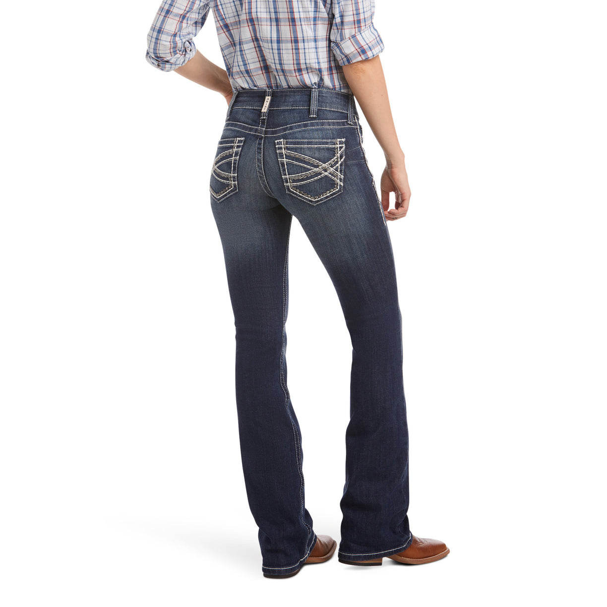Person wearing blue jeans and a plaid shirt on a white background
