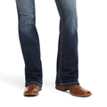 Dark blue jeans and brown shoes on a white background