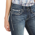Close-up of blue jeans with a white background
