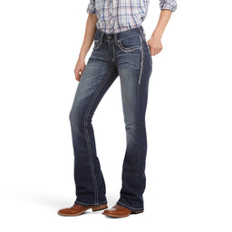 Person wearing blue jeans and a plaid shirt on a white background