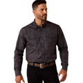 Man wearing a dark patterned shirt and black pants on a white background