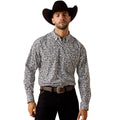 Man wearing a patterned shirt and cowboy hat on a white background
