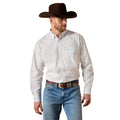 A man wearing a white long-sleeve western shirt with a small blue and red geometric pattern, paired with blue jeans, a brown belt, and a dark brown cowboy hat, shown against a plain white background.
