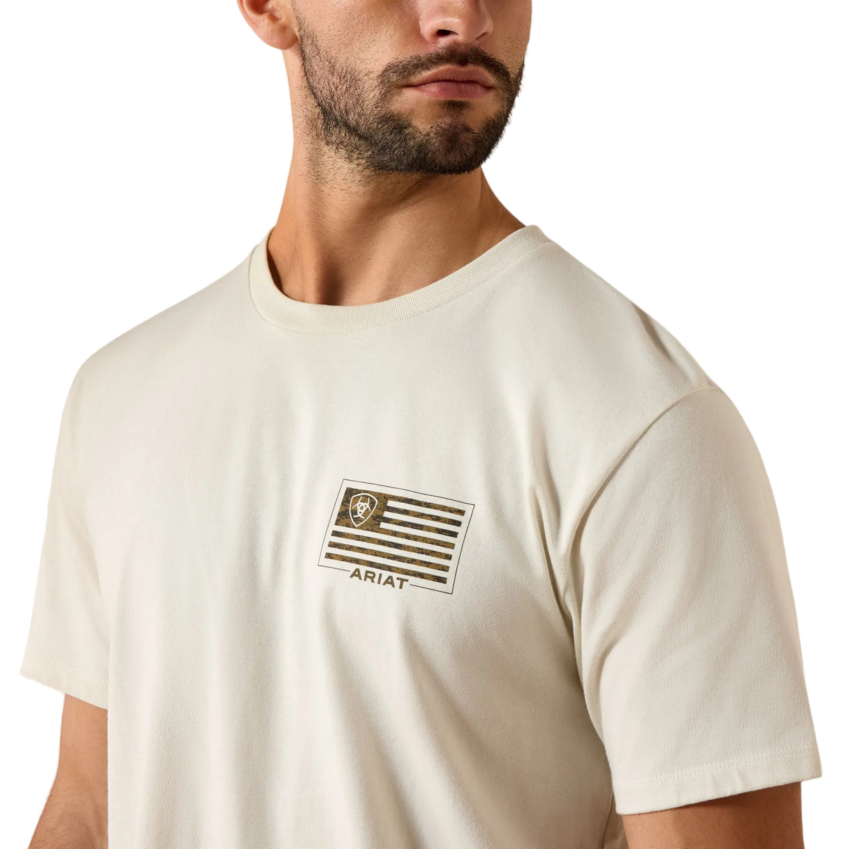 Man wearing a white t-shirt with a logo on a beige background