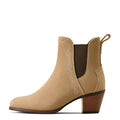 Beige nude suede ankle boot with brown heel on a white background