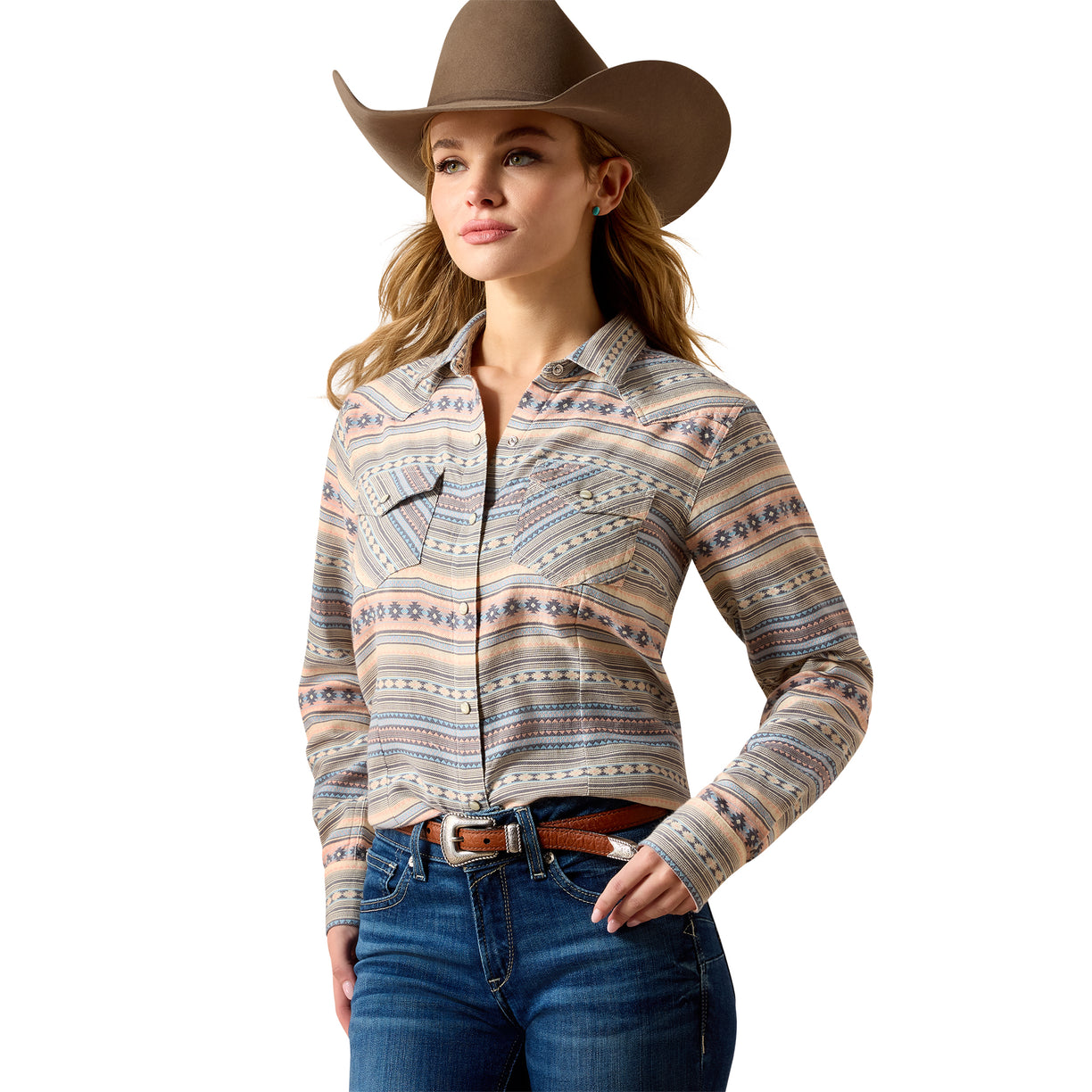 Woman wearing a patterned long-sleeve shirt, jeans, and a cowboy hat on a white background