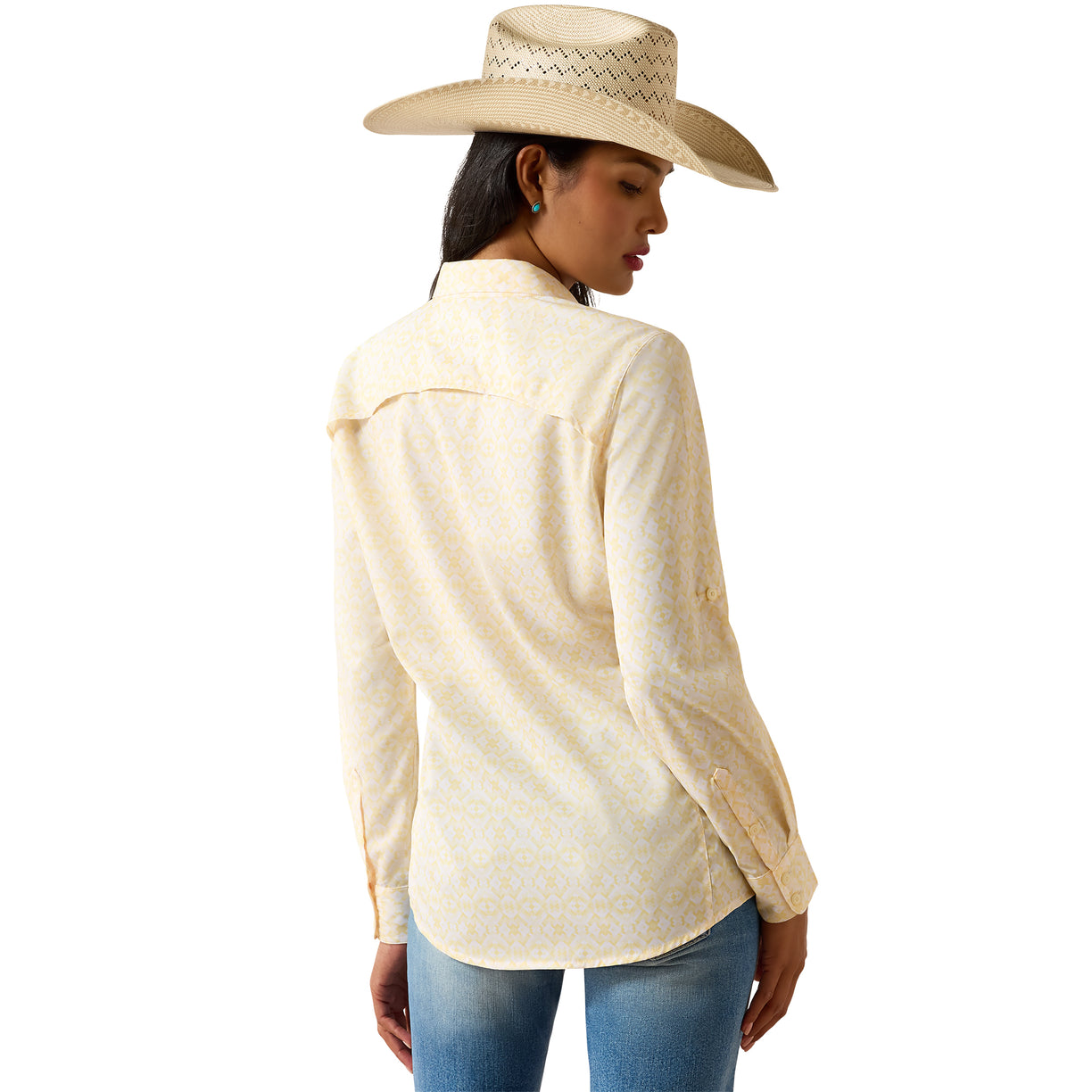 Woman wearing a beige long-sleeve shirt and cowboy hat on a white background