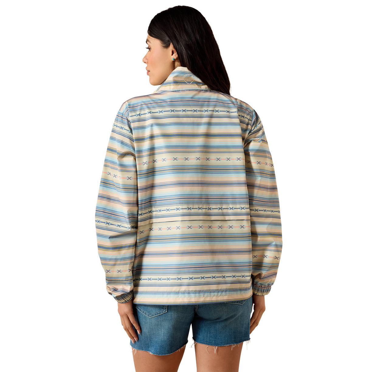 Woman wearing a patterned shirt with a white background