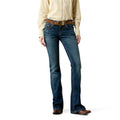 Person wearing blue jeans and a beige shirt on a white background