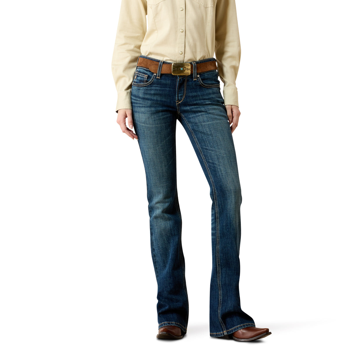 Person wearing blue jeans and a beige shirt on a white background