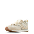 Beige sneaker with brown sole on a white background