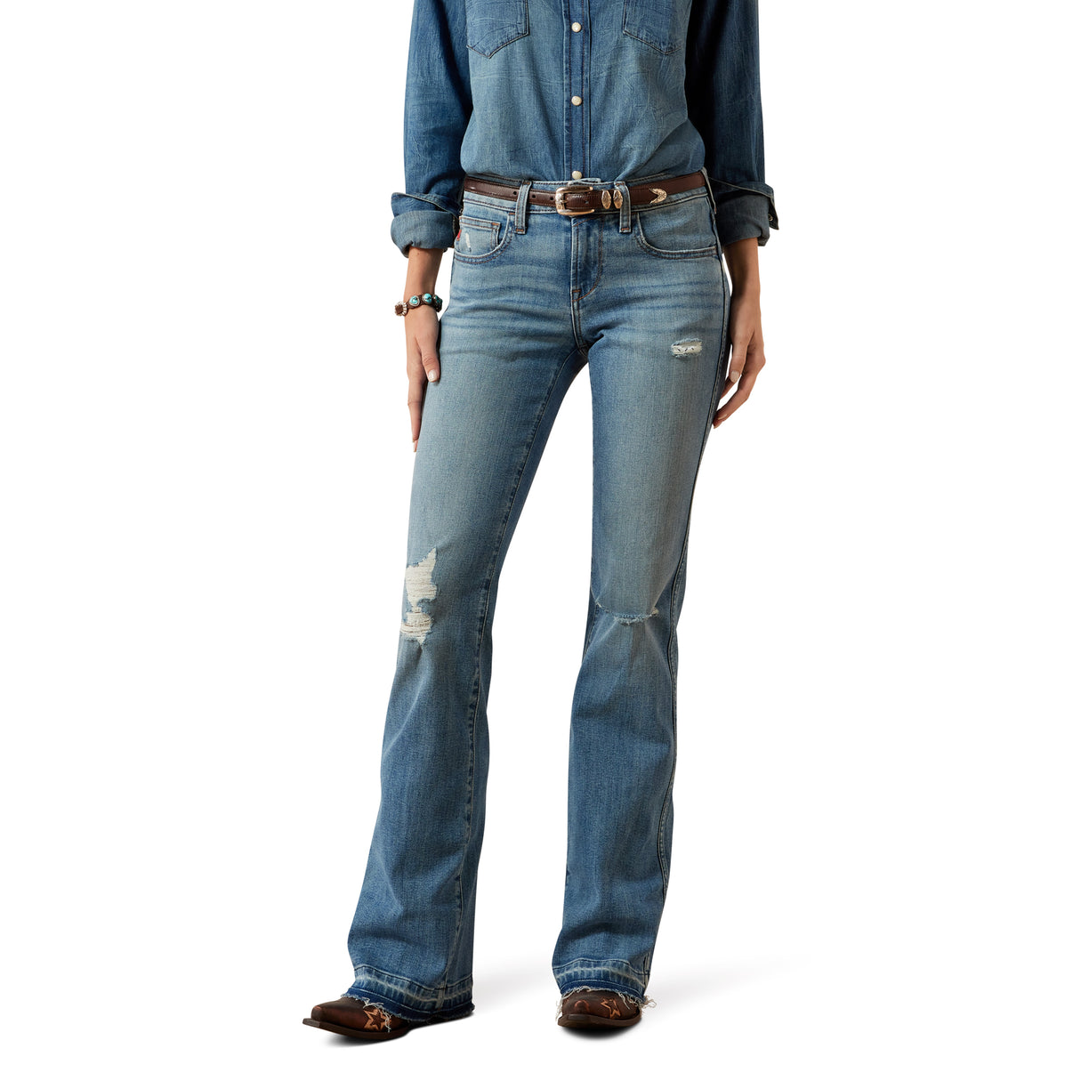 Person wearing blue jeans and a denim shirt on a white background