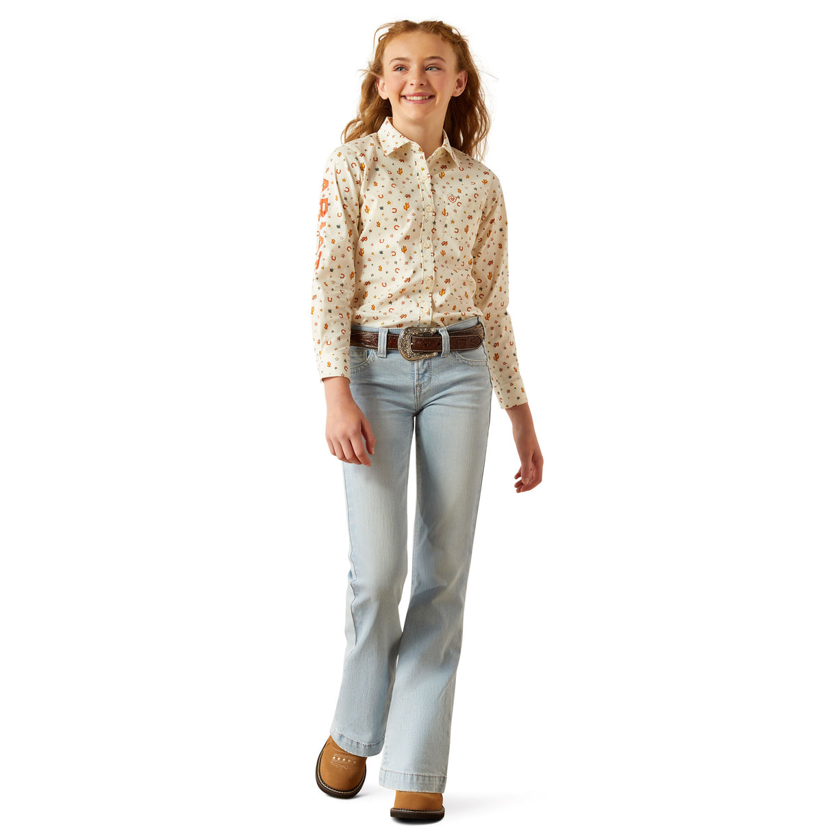 Person wearing a patterned shirt and light blue jeans on a white background