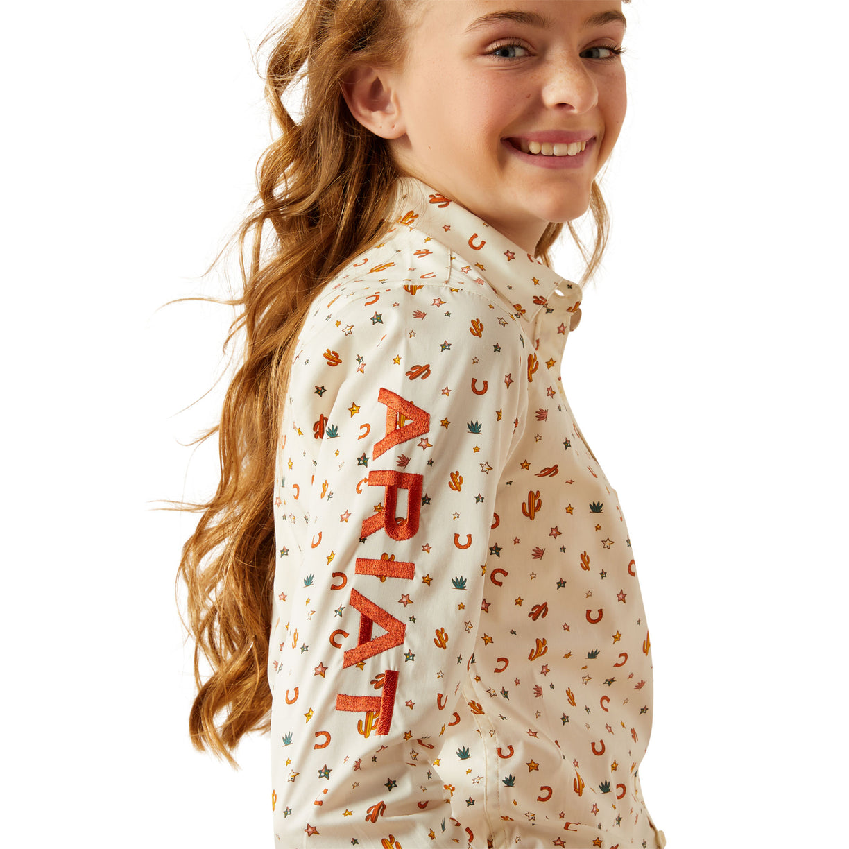 Girl wearing a patterned shirt with visible branding on a white background